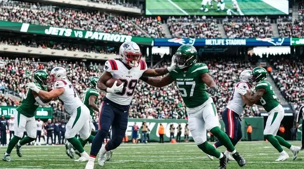 New York Jets and New England Patriots players competing during an NFL game at MetLife Stadium